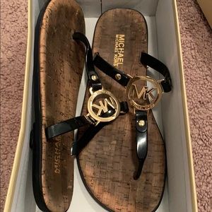 Patent MK thong sandals